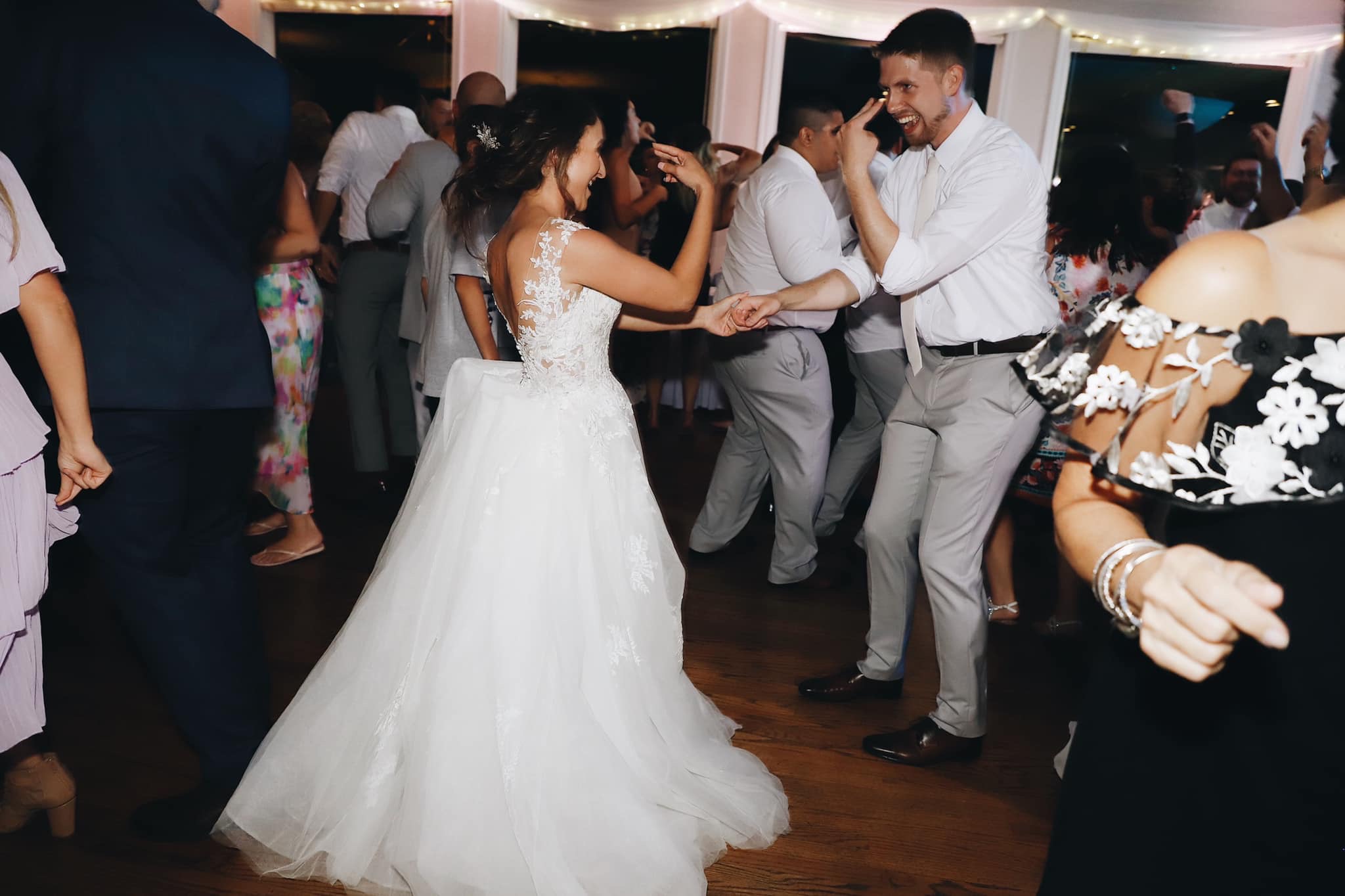 A bride and groom dancing at their wedding.